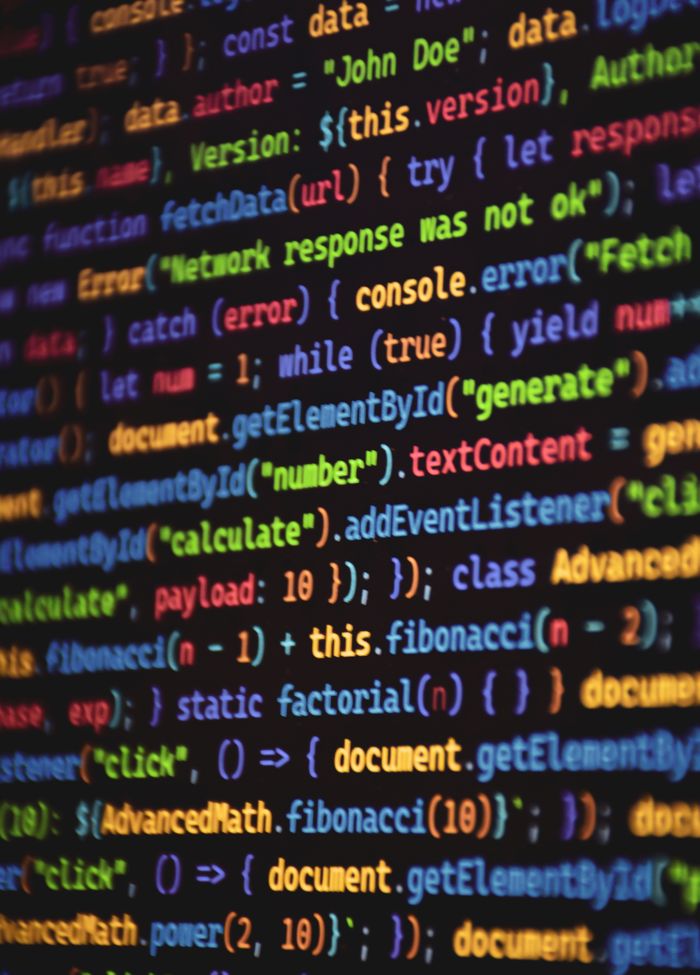 gallery-2 Close-up of vibrant colored JavaScript code showing functions and syntax on a dark screen.