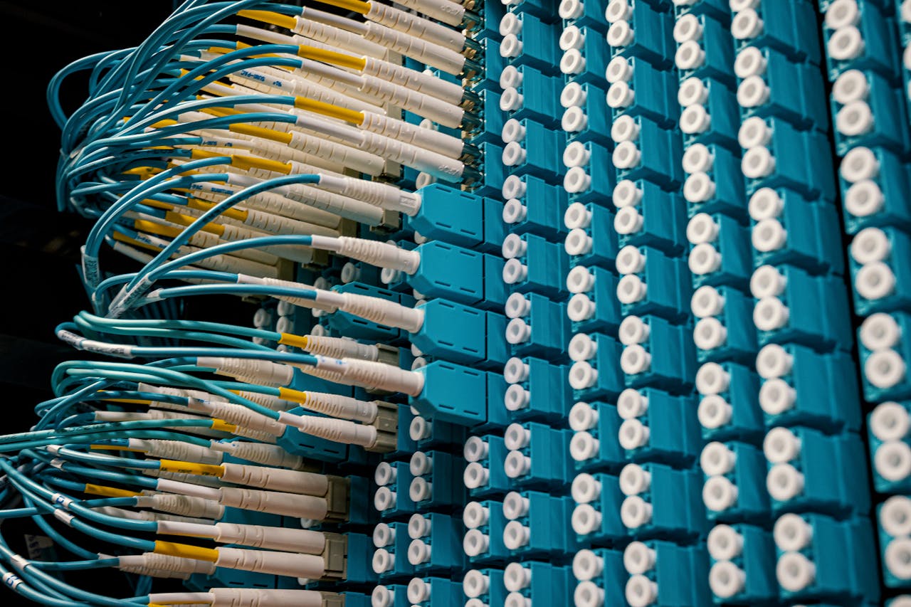 services-01 From below of fiber optic equipment with similar colorful rubber cables and round sockets